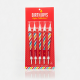 The BirthJays 5 Pack contains 5 BirthJay Cone Candles on a Red Gifting Card with a plastic blister mold protecting the BirthJays. A BirthJay is a colorful 98mm cone with a shiny crutch wrap, a candle topper that features a real 2cm candle that will burn for 10-25 seconds and mote to catch dripping wax, and a cake stake that you will slide the bottom of the cone into, so you avoid food in the filter of the cone. These are the perfect gift to elevate special occasions!